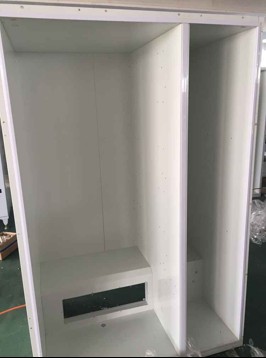 Empty white cabinet with foaming insulation