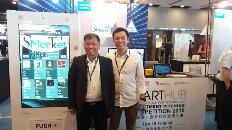 Customers at trade show with vending machine display